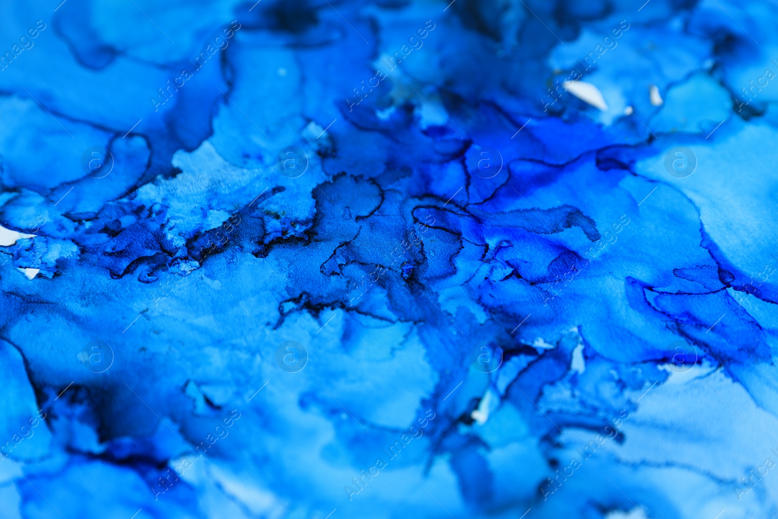 Photo of Abstract liquid ink art painting as background, closeup