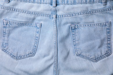 Photo of Jeans with pockets as background, top view