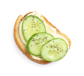 Slice of bread with spread and cucumber on white background, top view