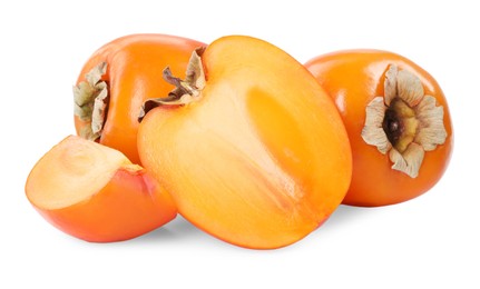 Photo of Whole and cut persimmon fruits isolated on white