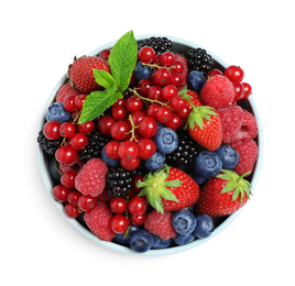 Mix of different fresh berries and mint in bowl on white background, top view