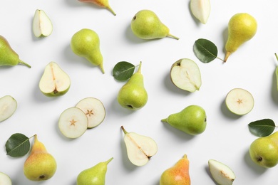 Photo of Ripe juicy pears on white background, top view