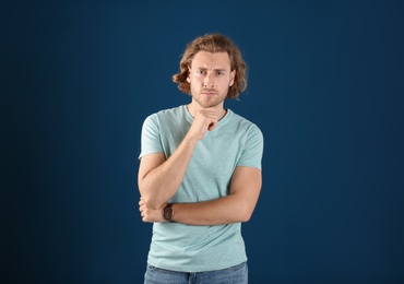 Photo of Portrait of handsome man on color background