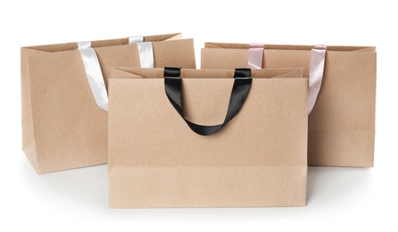 Photo of Paper shopping bags isolated on white. Mock up for design