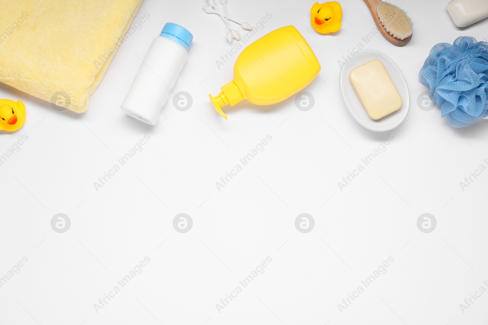 Photo of Different baby bath accessories and cosmetic products on white background, flat lay. Space for text