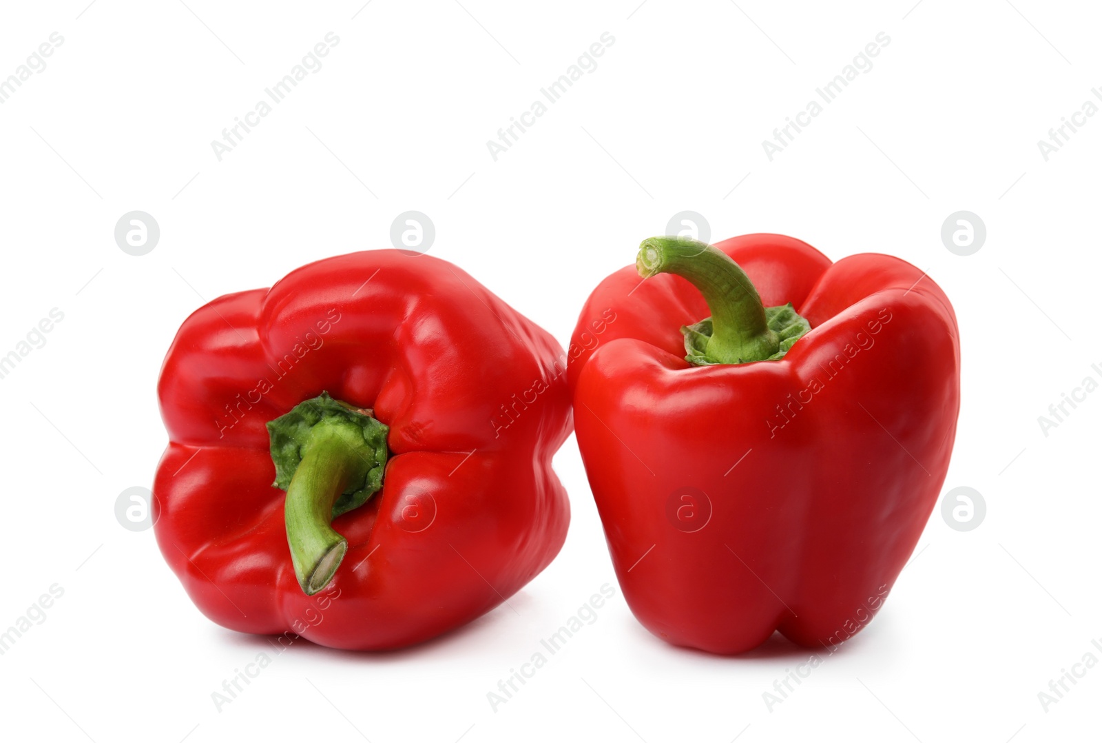 Photo of Raw ripe paprika peppers on white background