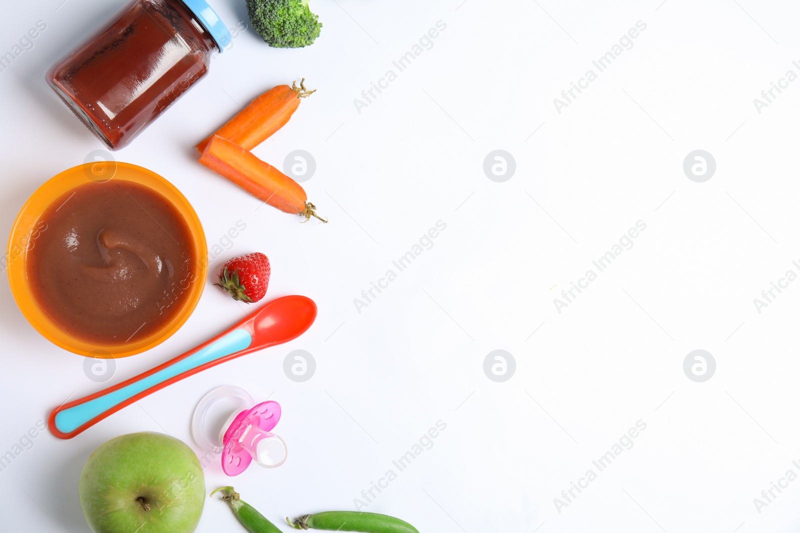 Photo of Flat lay composition with healthy baby food and ingredients on white background. Space for text