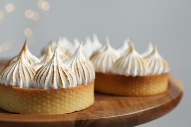 Tasty dessert. Tartlets with meringue on table, closeup