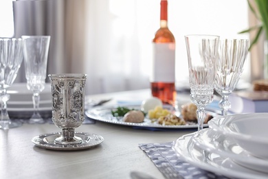 Photo of Table served for Passover (Pesach) Seder indoors, space for text