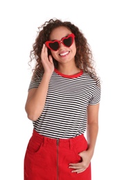 Young beautiful African-American woman wearing heart shaped glasses on white background