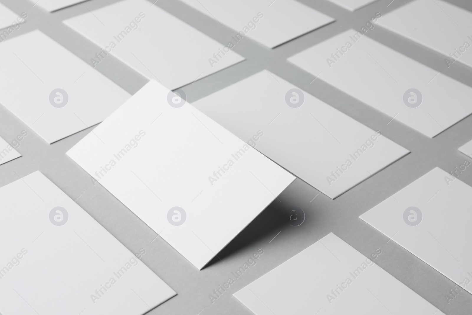 Photo of Blank business cards on light gray background, closeup. Mockup for design