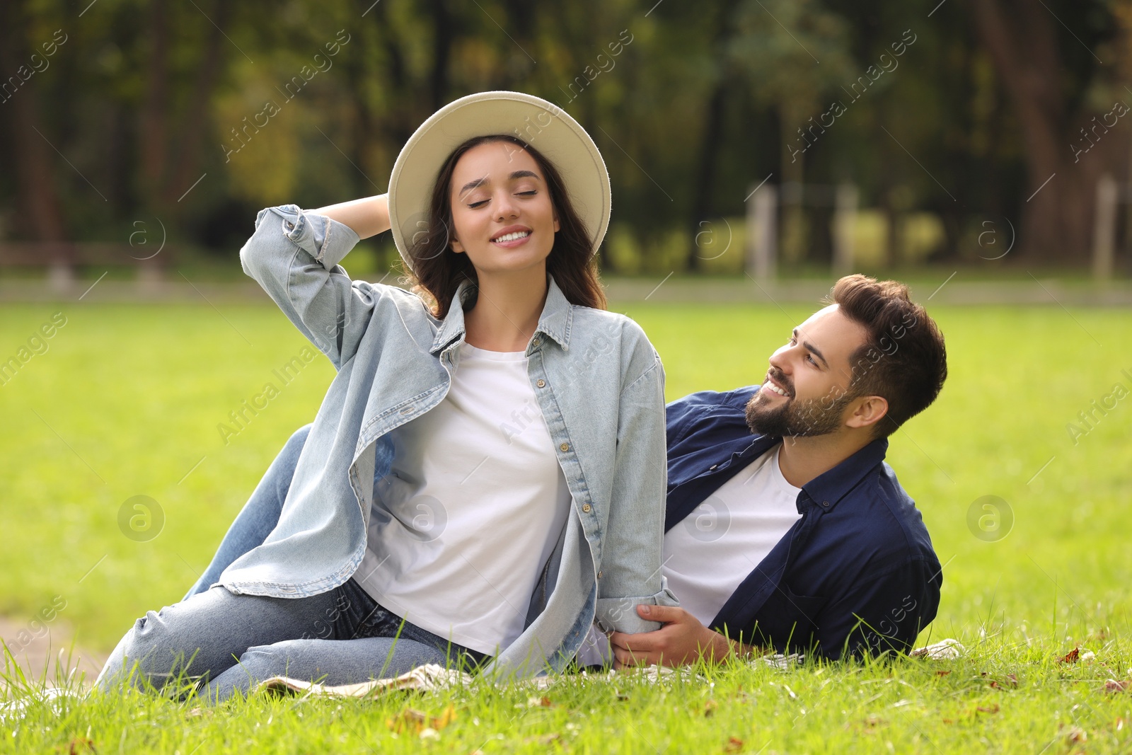 Photo of Beautiful couple spending time together in park
