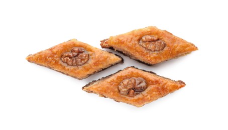 Delicious honey baklava with walnuts on white background, top view