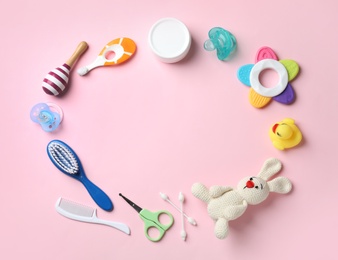 Photo of Flat lay composition with baby accessories and toys on color background. Space for text