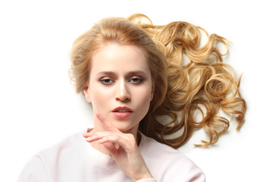 Portrait of beautiful young woman with dyed long hair on white background, top view