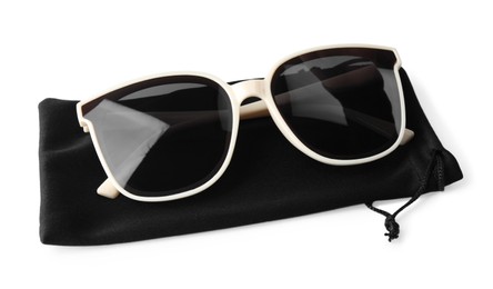 Photo of Stylish sunglasses with black cloth bag on white background