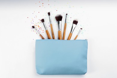 Photo of Flat lay composition with makeup brushes on white background
