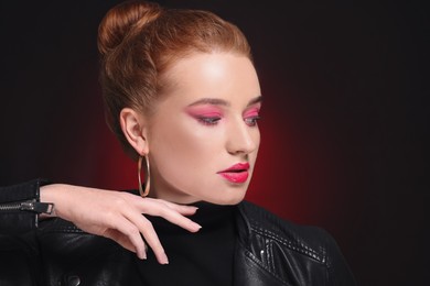 Photo of Portraitbeautiful young woman with makeup posing on color background