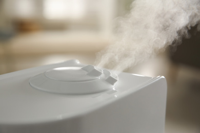 Modern humidifier on blurred background, closeup view