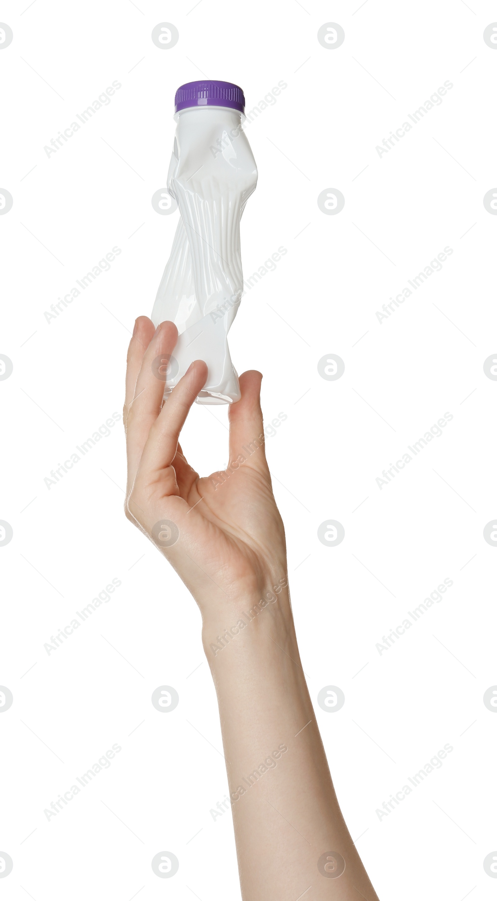 Photo of Woman holding crumpled plastic bottle on white background, closeup