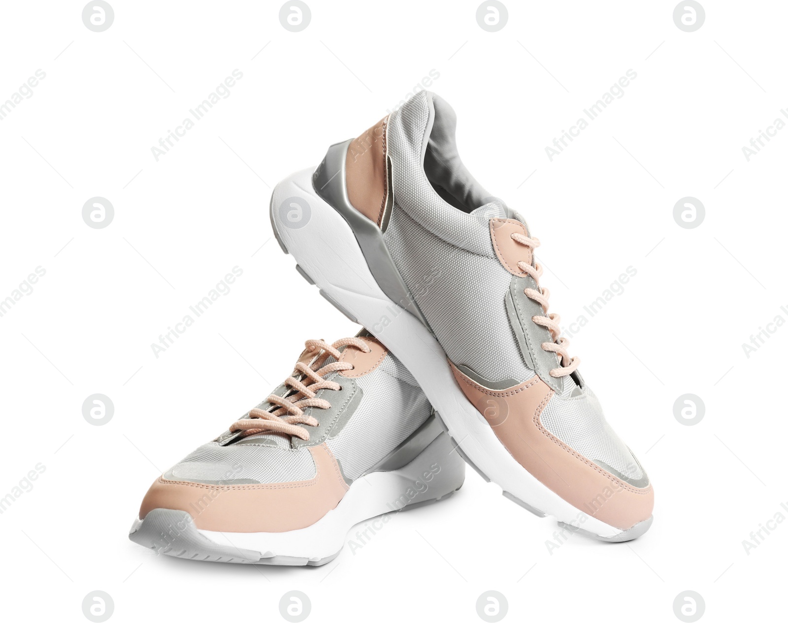 Photo of Pair of sports shoes on white background