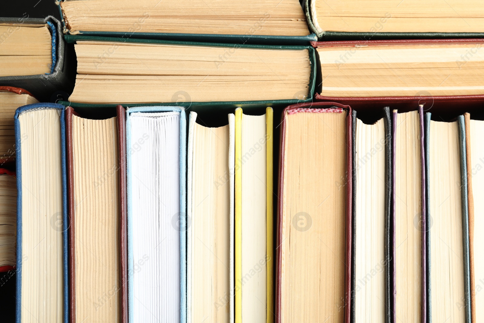 Photo of Many different hardcover books as background, top view