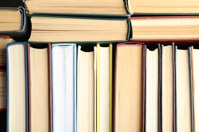 Photo of Many different hardcover books as background, top view