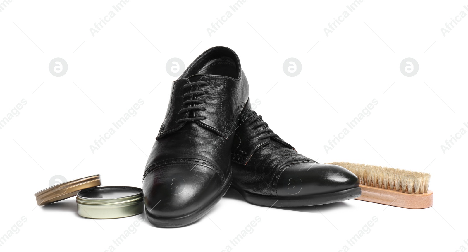 Photo of Stylish men's footwear and shoe care accessories on white background