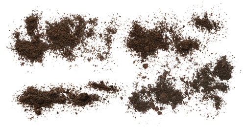 Set with piles of fertile soil on white background, top view