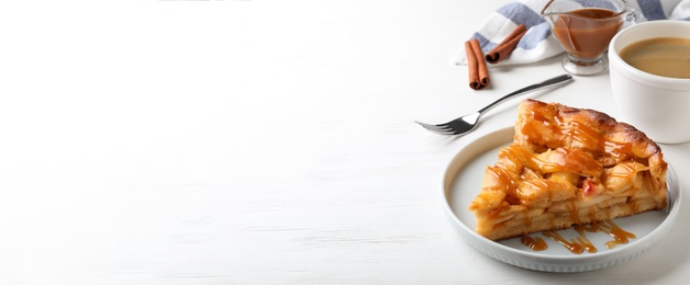 Image of Traditional apple pie served with coffee on white wooden table, space for text. Banner design