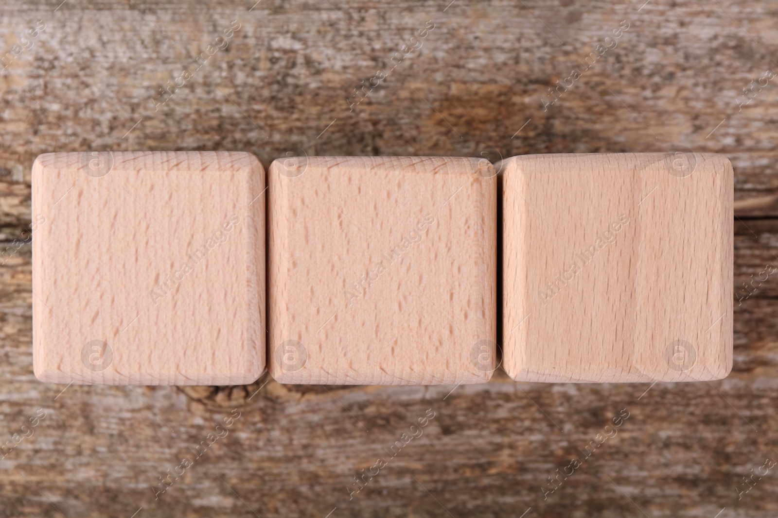 Photo of International Organization for Standardization. Cubes with abbreviation ISO on wooden table, top view