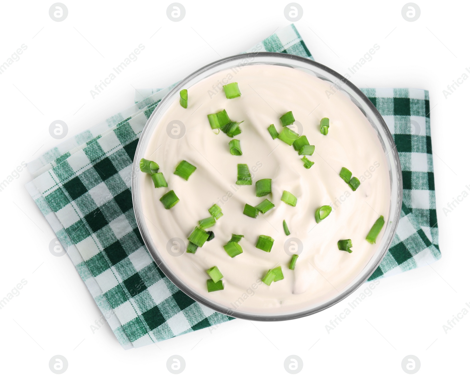 Photo of Fresh sour cream with onion and fabric on white background, top view