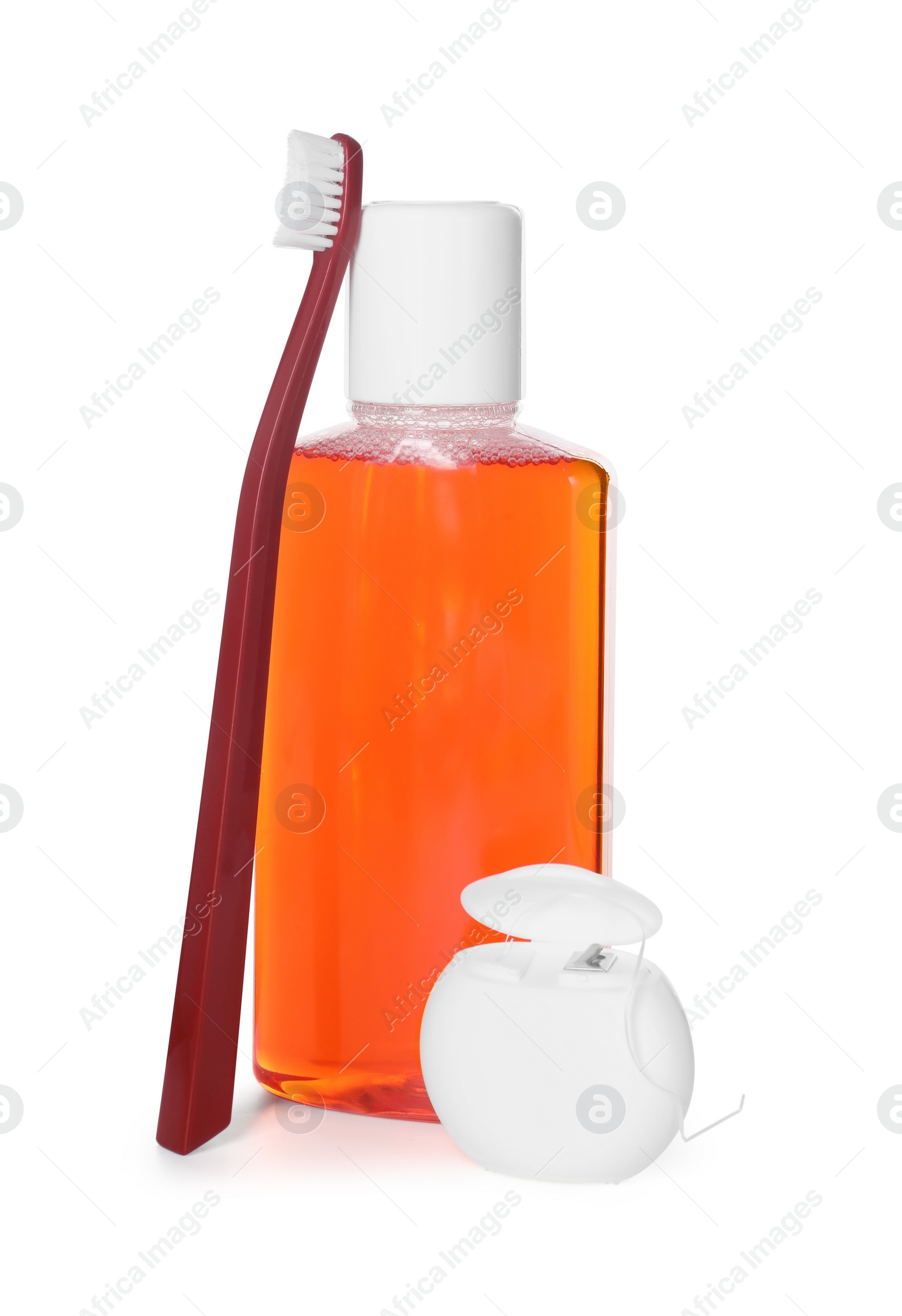 Photo of Mouthwash, toothbrush and dental floss isolated on white