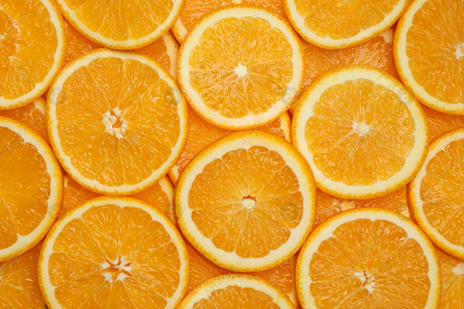 Photo of Fresh orange slices as background, top view