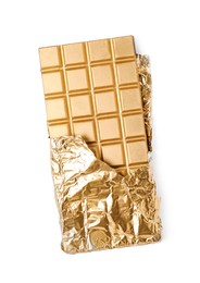 Photo of Shiny golden chocolate bar with foil on white background, top view