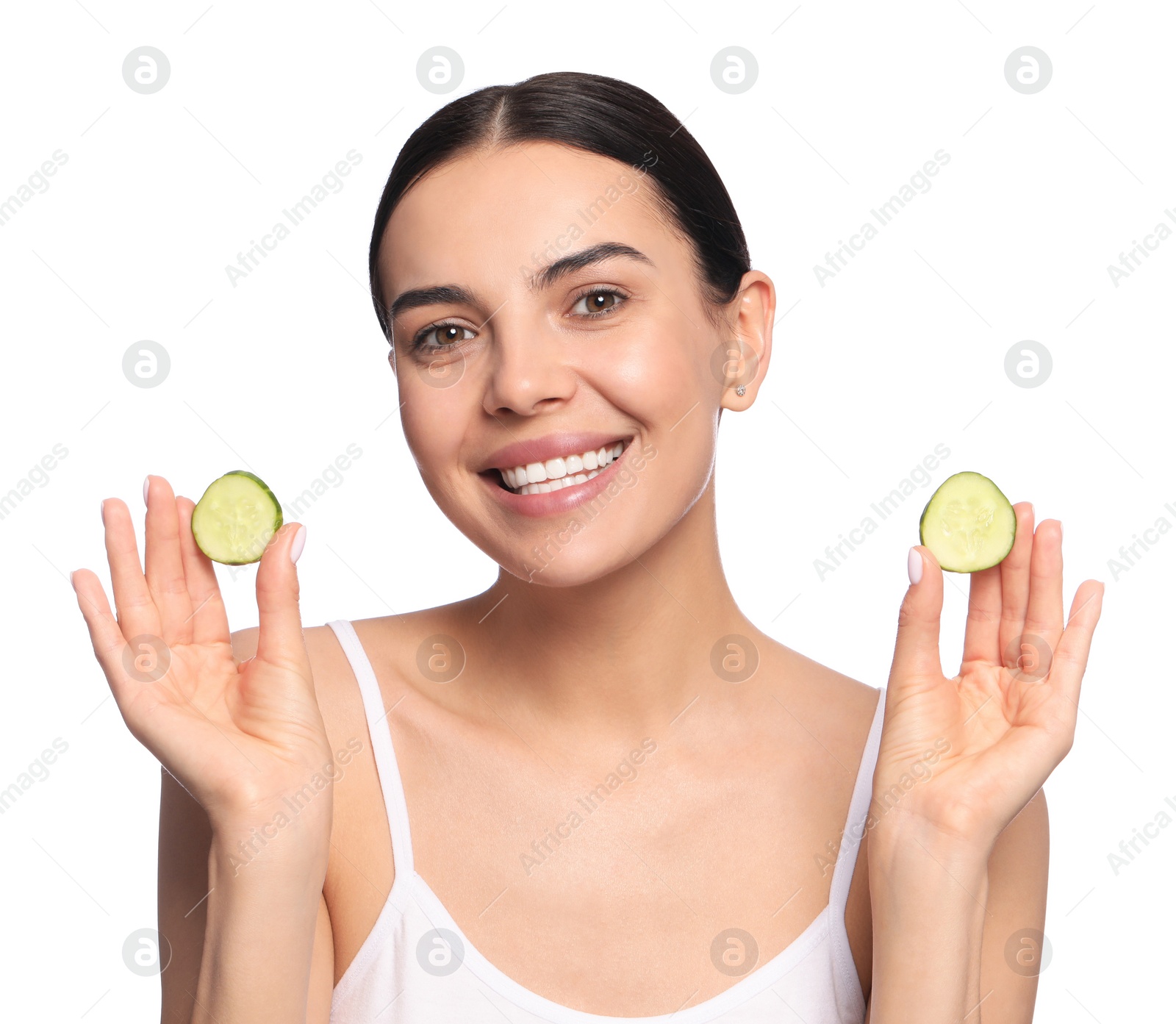 Photo of Beautiful young woman with slices of cucumber on white background