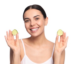 Beautiful young woman with slices of cucumber on white background