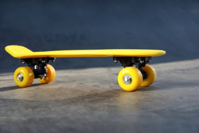 Modern yellow skate board outdoors. Sport equipment
