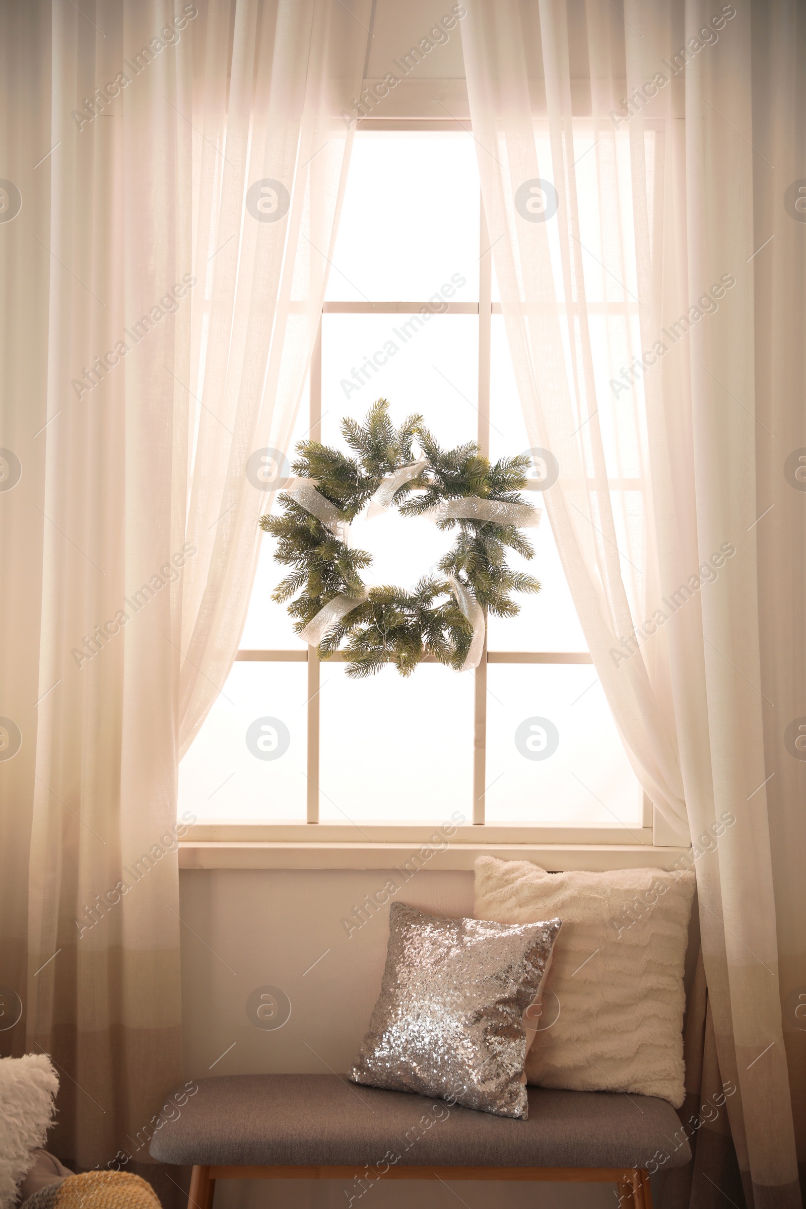 Photo of Stylish Christmas interior with decorative wreath