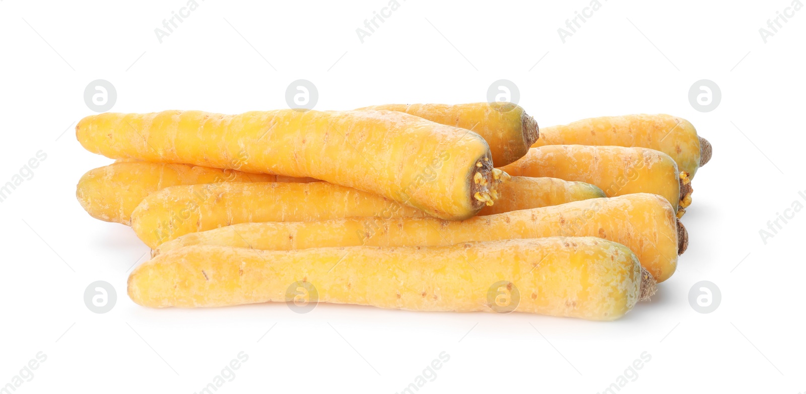 Photo of Fresh raw yellow carrots isolated on white