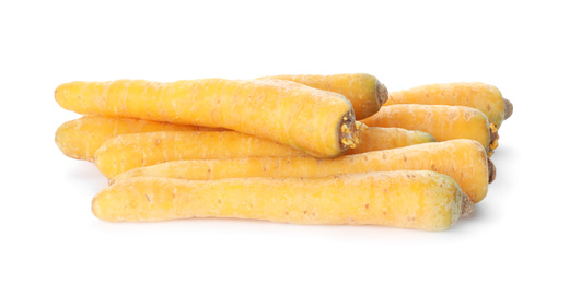 Photo of Fresh raw yellow carrots isolated on white