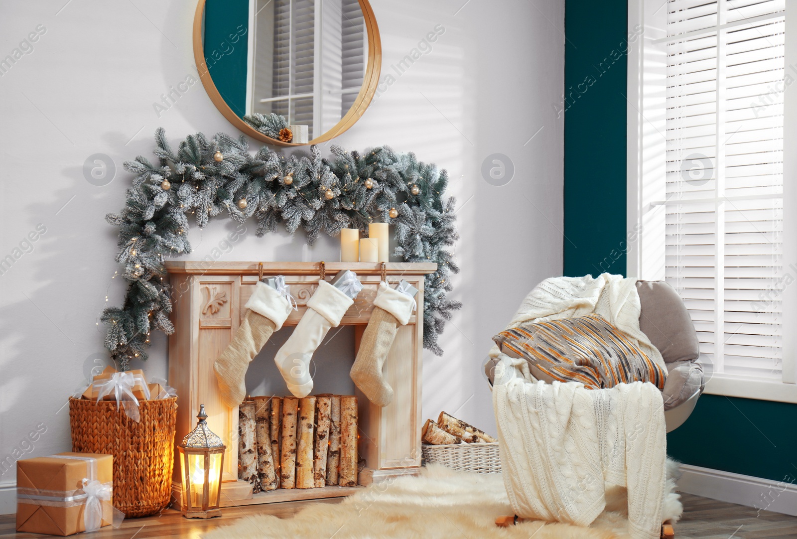 Photo of Fireplace with Christmas stockings in festive room interior