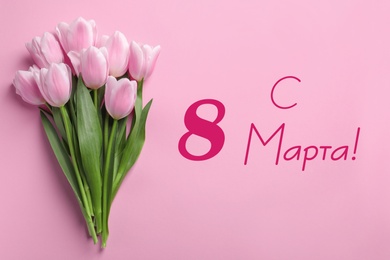 Image of International Women's Day greeting card design. Beautiful spring tulips and text Happy 8 March written in Russian on pink background, top view