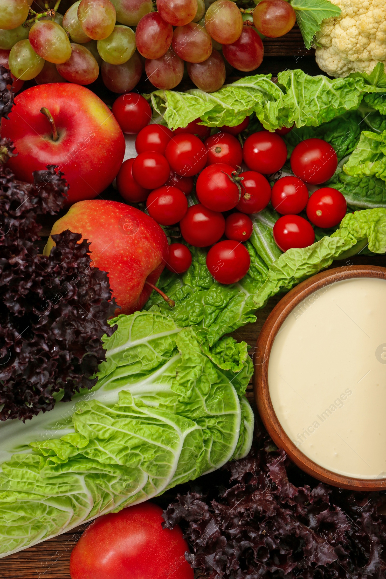 Photo of Different fresh ripe vegetables, sour cream and fruits as background, top view. Farmer produce