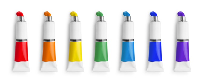 Image of Set of tubes with colorful oil paints on white background, top view