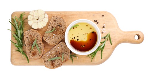 Bowl of organic balsamic vinegar with oil, bread slices and spices isolated on white, top view