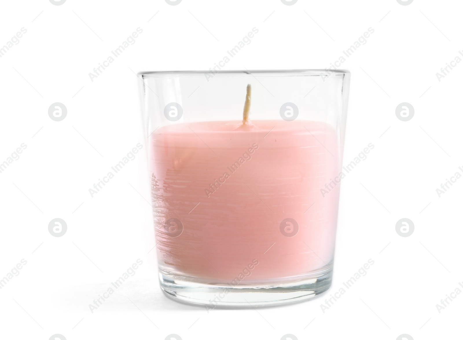 Photo of Glass with wax candle on white background