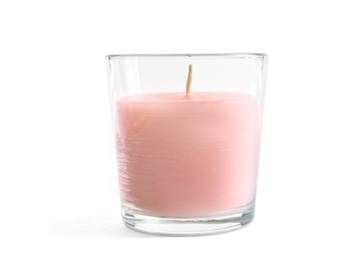 Photo of Glass with wax candle on white background