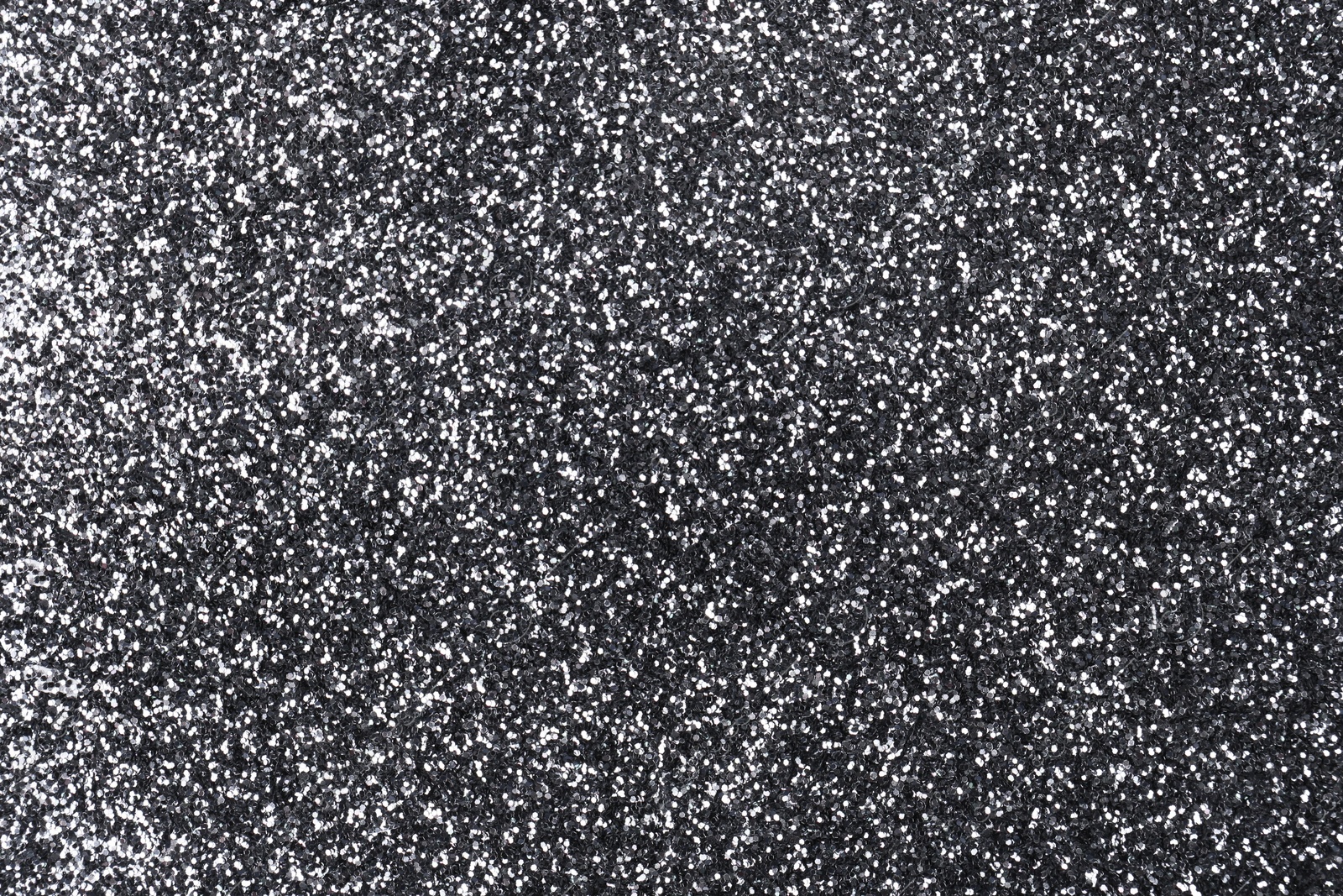 Photo of Shiny silver glitter as background, top view