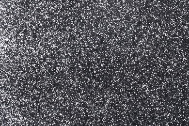 Photo of Shiny silver glitter as background, top view